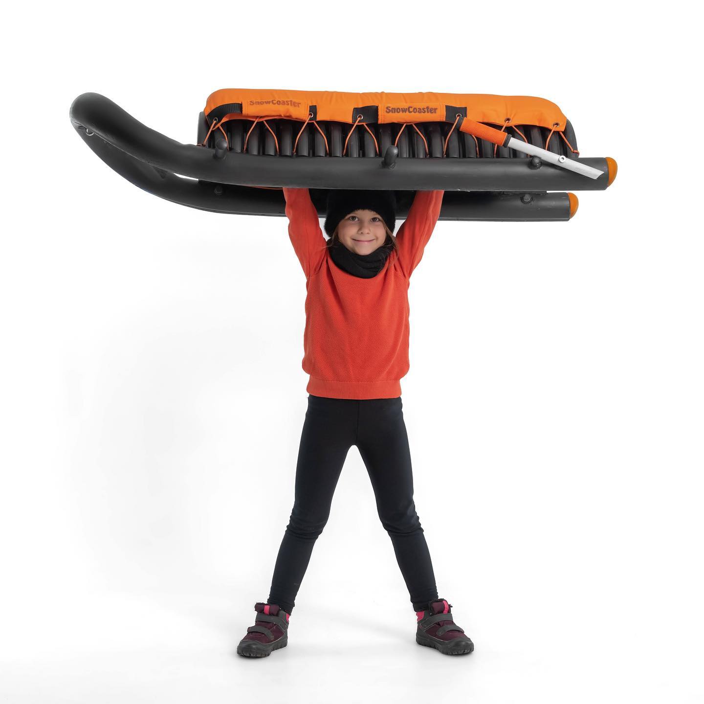 Child holding SnowCoaster